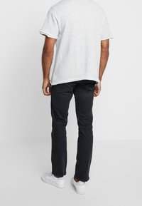 Wrangler Vaqueros rectos - black denim