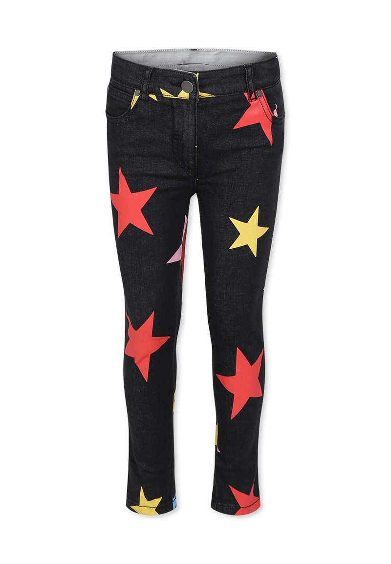 Jeans in denim su sfondo nero con motivi di stelle colorati in rosso, giallo e rosa. Design aderente con vita di media altezza.