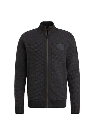 Dark zippered cardigan with a textured knit pattern, ribbed cuffs, and hem. Features a patch on the chest and side pockets.