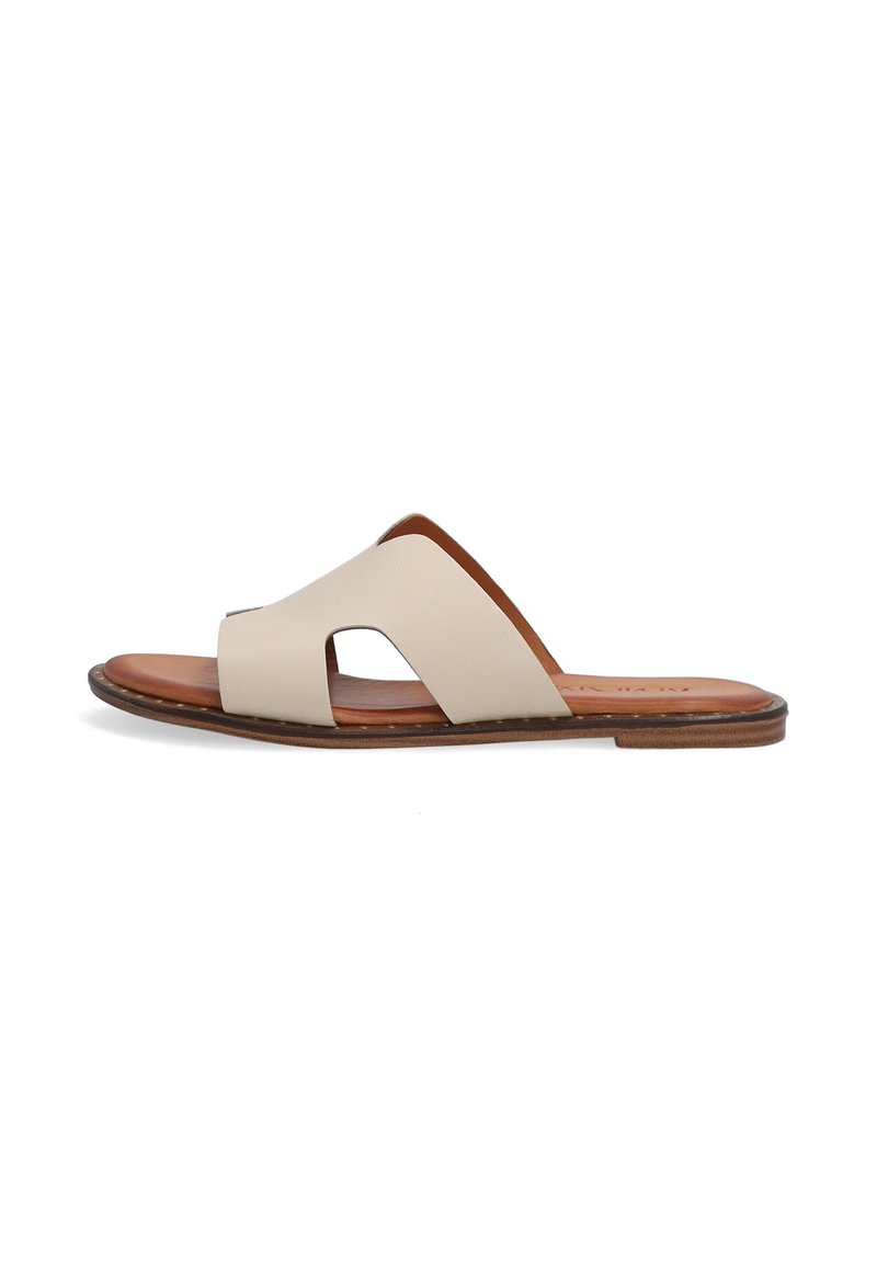 Beige leather slide sandal with open toe, featuring two cut-out straps and a brown sole. Smooth texture and simple design.