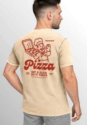 Tan t-shirt with a graphic of a pizza chef holding a pizza box. Red text includes "Pizza" and "Eat a slice do it twice." Short sleeves.