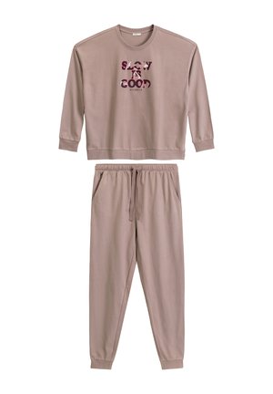Jasnobrązowy zestaw bluzy i spodni dresowych wykonany z miękkiej tkaniny. Bluza ma okrągły dekolt i graficzny nadruk. Spodnie dresowe mają elastyczny pas.
