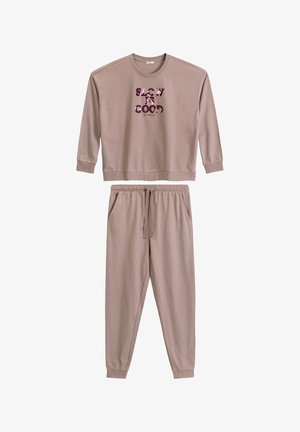 Jasnobrązowy zestaw bluzy i spodni dresowych wykonany z miękkiej tkaniny. Bluza ma okrągły dekolt i graficzny nadruk. Spodnie dresowe mają elastyczny pas.