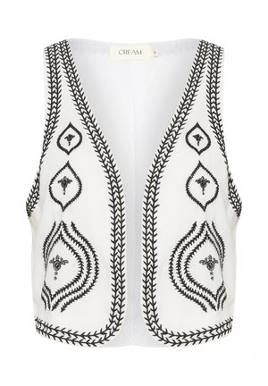 Débardeur court blanc avec des motifs floraux noirs brodés et des coutures en zigzag le long des bords. Design à l'avant ouvert, sans fermetures.