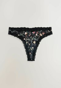 Zwarte kanten string met bloemenpatroon, voorzien van delicate kantafwerking langs de tailleband en benen. Het satijnachtige materiaal zorgt voor een soepele textuur.