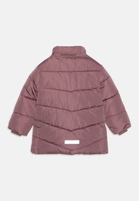 Puffer jacket in a mauve color, featuring a quilted design with horizontal stripes, high collar, and a rectangular white label on the back.