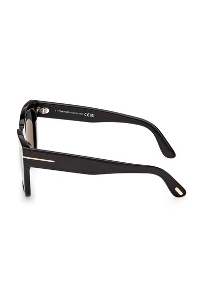 Lunettes de soleil rectangulaires noires Tom Ford vues de côté avec des détails dorés sur les branches et l'inscription « Made in Italy » à l'intérieur.