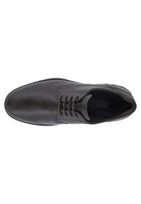 Scarpa da uomo in pelle nera con finitura liscia, punta tonda, design con lacci e dettagli di cucitura discreti. Interno etichettato con il nome del brand.
