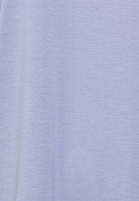 Light purple T-shirt featuring a smooth, soft texture and a simple, unadorned design. The fabric appears lightweight and breathable.