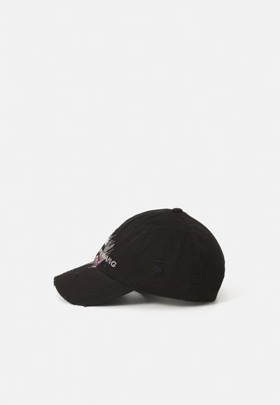 Black baseball cap made of fabric, featuring embroidered graphics and text on the front. Curved visor with slight fraying details.