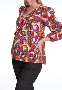Multicolore paisley blouse met een V-hals, korte pofmouwen en een geraffineerde taille. Gemaakt van lichte stof met een gestructureerde weving.