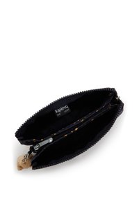 Black zippered wallet featuring a patterned interior, smooth texture, and a small fluffy keychain accent. Labeled "Kipling Live Light."