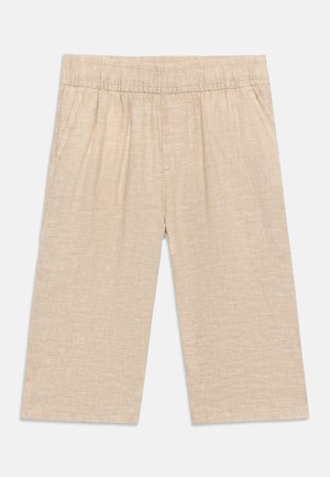 Beige knælange shorts med elastisk taljebånd og sidelommer, lavet af et let tekstureret stof.