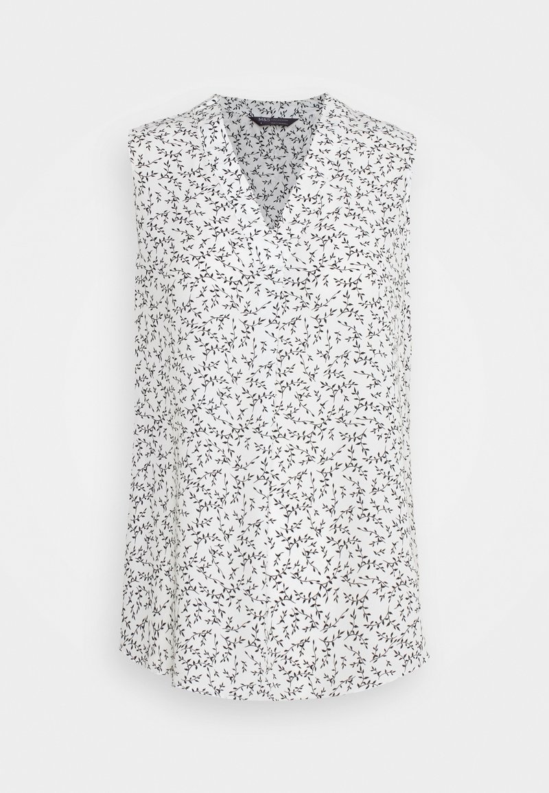 Blouse blanche sans manches avec un petit motif de branches et feuilles noires et un col en V.
