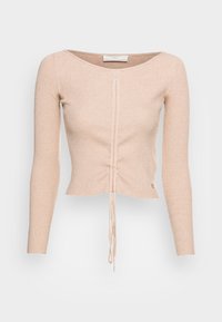 Beige geripptes Langarmoberteil mit rundem Halsausschnitt und Kordelzugdetail am Saum, mit strukturiertem Oberflächen und subtiler Markenkennzeichnung.