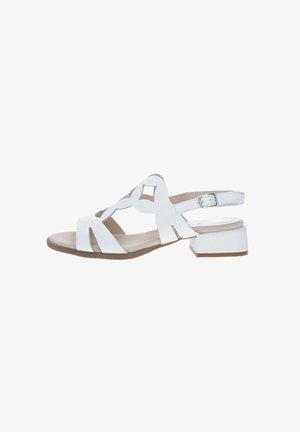 Sandal in pelle bianca con tacco piatto, design con ritagli e cinturino alla caviglia con fibbia. Fodera interna liscia, soletta beige e suola marrone.
