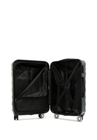 Valigia rigida verde con interni neri, doppie compartimenti, tasche con zip e cinghie elastiche. Caratterizzata da quattro ruote girevoli per la mobilità.