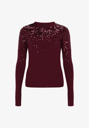 Burgundowy sweter o prążkowanej fakturze, z cekinami w gradientzie od czarnego do różowego na ramionach, okrągłym dekolcie i długich rękawach.