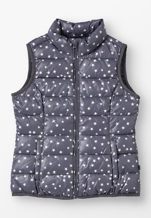 Veste matelassée sans manches avec fermeture éclair devant, tissu bleu foncé orné de motifs d'étoiles blanches et col montant.