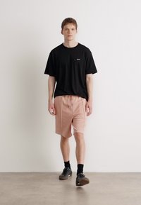 HUGO DEXEY RB - Donji dijelovi trenirke - light pastel pink