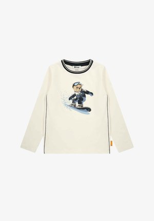 Hvid langærmet skjorte med sort kant og en grafik af en bjørn, der snowboarder med goggles og vintertøj på fronten.