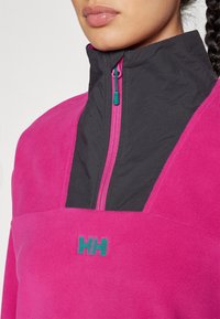 Helly Hansen DAYBREAKER CROPPED  - Vesta od flisa - magenta