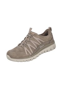 Zapatilla de ante beige con cordones elásticos, parte superior texturizada, cuello acolchado y suela de goma blanca con un patrón de olas.