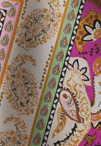 Multicolored fabric featuring paisley and floral patterns in pink, orange, green, and black. Smooth texture with intricate detailing throughout.
