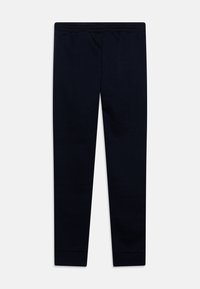 Mørkeblå joggebukser laget av myk stoff. Har stretchy midje og innsvingte ben, med elastiske mansjetter ved anklene. Ingen mønstre.