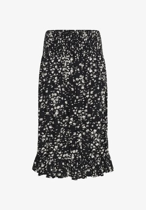 Jupe noire avec un motif floral blanc, taille smockée et ourlet à volants. Tissu léger avec un design fluide, longueur genou.