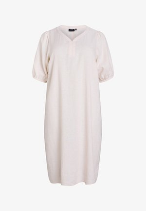 Gaiši bežs kleita ar V veida izgriezumu, īsām pūkainām piedurknēm un A formas siluetu. Izgatavota no mīksta auduma ar smalku faktūru.