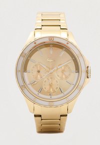 Gold metal wristwatch with three subdials, stick hour markers, and a rotating bezel marked in increments of ten minutes.