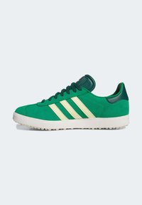 Green suede sneakers with three cream stripes, rubber outsole, and green accents on the collar and tongue. Features textured surface.