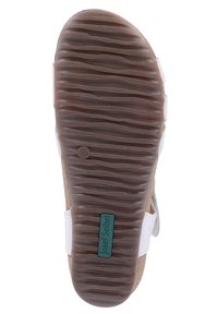Brown rubber sole with textured ridges, labeled size 38; cork and white straps visible on side. Lightweight design suitable for casual wear.