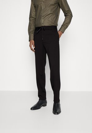 GYTE - Pantalon de survêtement - black
