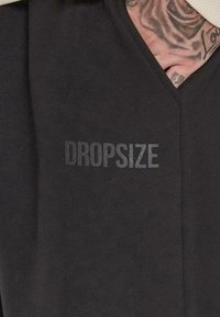 Dropsize LOOSE FIT  - Træningsbukser - black