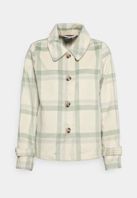 Krémová a zelená károvaná bunda s límečkem, čtyři uzávěry na hnědé knoflíky a rukávy s manžetami; měkká textura látky.