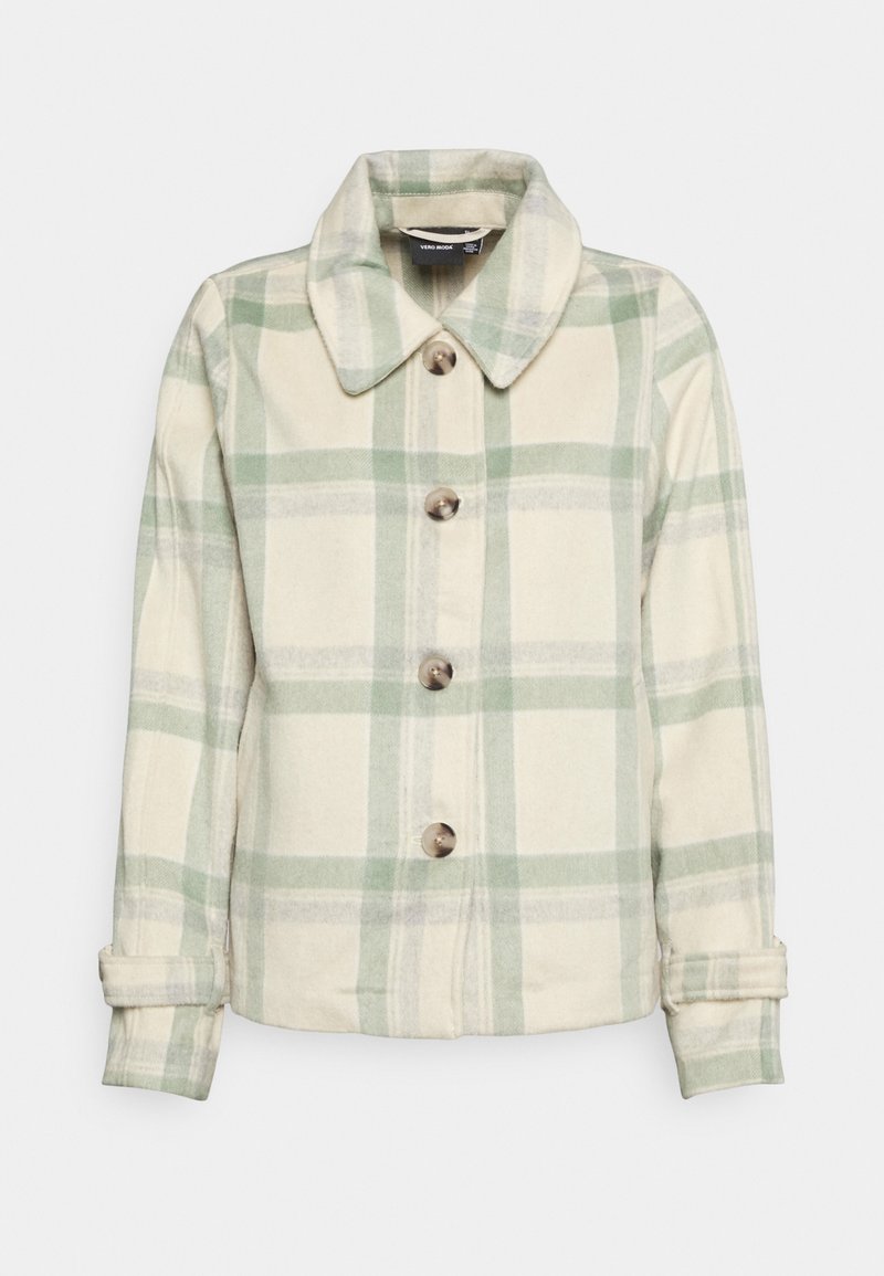 Krémová a zelená károvaná bunda s límečkem, čtyři uzávěry na hnědé knoflíky a rukávy s manžetami; měkká textura látky.