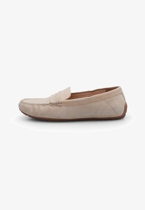 Beige suede moccasin shoe with a rounded toe, decorative stitching, and a flat rubber sole. Side detail includes subtle perforations.
