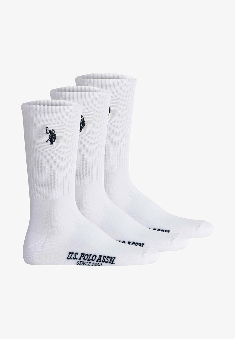Drei Paar weiße Crew-Socken mit geripptem Textil, ausgestattet mit einem schwarzen gestickten Logo und schwarzem Text "U.S. POLO ASSN. SINCE 1890" auf den Sohle.