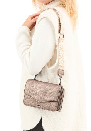 Crossbody bag in textured metallic bronze with a flap closure, adjustable patterned strap, and silver hardware.