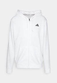 Biała bluza z kapturem na zamek błyskawiczny, z regulowanym kapturem, dwoma przednimi kieszeniami oraz czarnym logo Adidas na lewej piersi. Miękka tkanina i ściągacze przy mankietach.