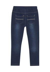 Navyblauwe jeggings van denim stof. Beschikt over twee achterzakken met ritsen en contrasterende stiksels. Slank pasvorm ontwerp.