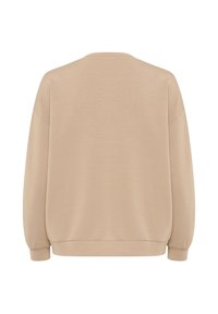 Beige sweatshirt med en avslappnad passform, rund halsringning och långa ärmar. Har en mjuk textur och ribbade muddarna och fållen. Inga synliga märken eller mönster.
