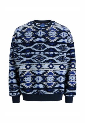 Flee sweatshirt med ett mönster i blått och marinblått. Har rund halsringning och ribbade ärmslut och nederkant. Mjukt, texturerat tyg.