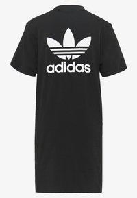 Svart bomulls t-shirt med korta ärmar, med en stor vit Adidas-logotyp och trefoil-grafik på baksidan. Rak skärning.