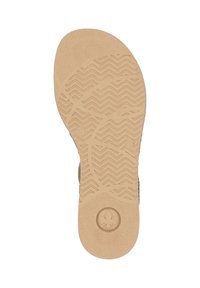 Shoe sole with a textured tan rubber material, featuring a zigzag pattern and a floral emblem in the center. Flat, ergonomic design.