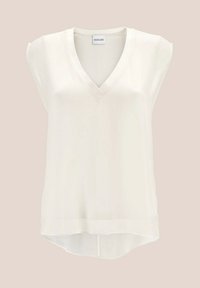 V-hals, mouwloze blouse in lichtgewicht crèmekleurige stof, met een licht gebogen zoom en subtiele glans. Gladde textuur, geen patronen.