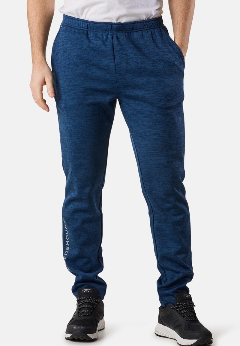 Marineblaue Sporthose mit meliertem Muster, elastischem Bund und weißem Logodetail an der Seite, ausgestattet mit zwei Seitentaschen.