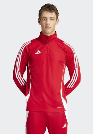 Rode sportieve zip-up shirt met witte streepaccenten, lange mouwen en adidas-logo. Gemaakt van glad, ademend materiaal voor comfort.